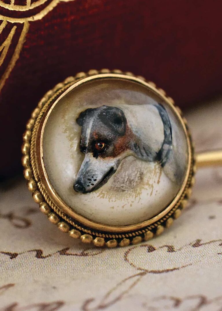 This Victorian stickpin c.1875 shows the crystal cabochon dome and hand painted reverse intaglio of a terrier or Italian greyhound, which would have been painted with a single hair brush; the crystal intaglio is a mere 1.5cm diam. It was offered for sale by Graisons Fine Jewellery (online jewellery store) for $1400. Image: Graisons Fine Jewellery.