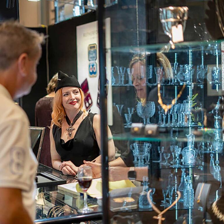 Viewing glassware cabinets at AAADA Antique and arts fair Sydney