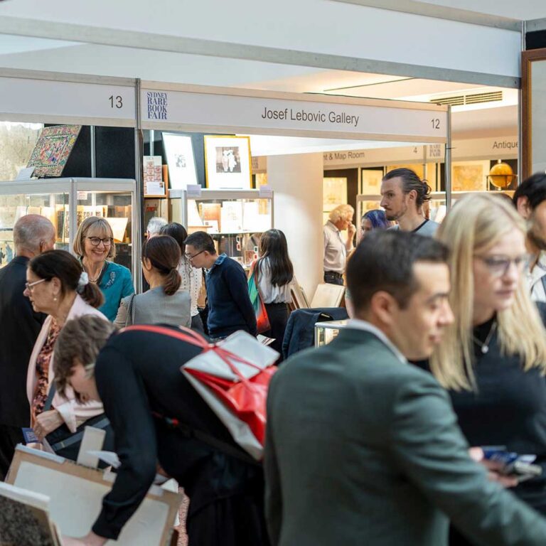 Visitors browsing exhibitor stands during opening night at the Sydney Rare Book Fair, State Library of NSW.