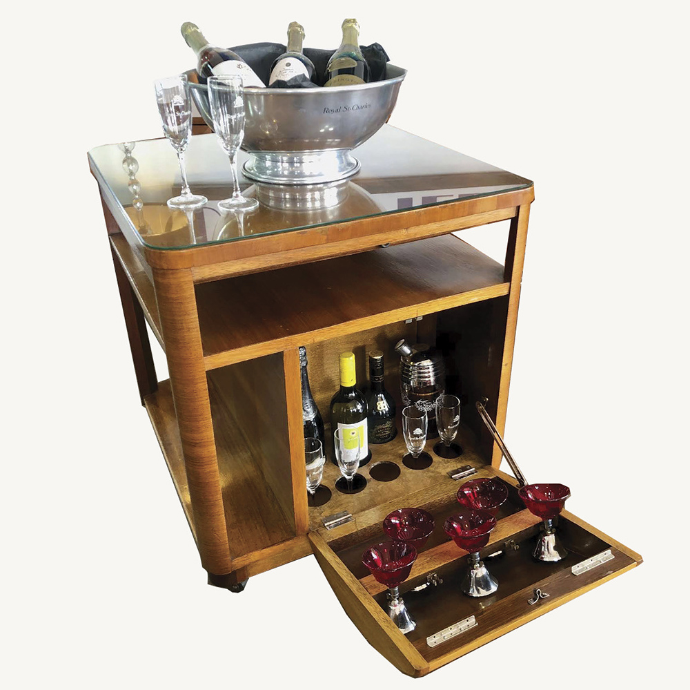 incorporates open shelving and a concealed curved-front compartment