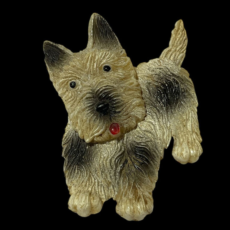 Vintage 1930s celluloid brooch in the form of a jaunty little terrier
