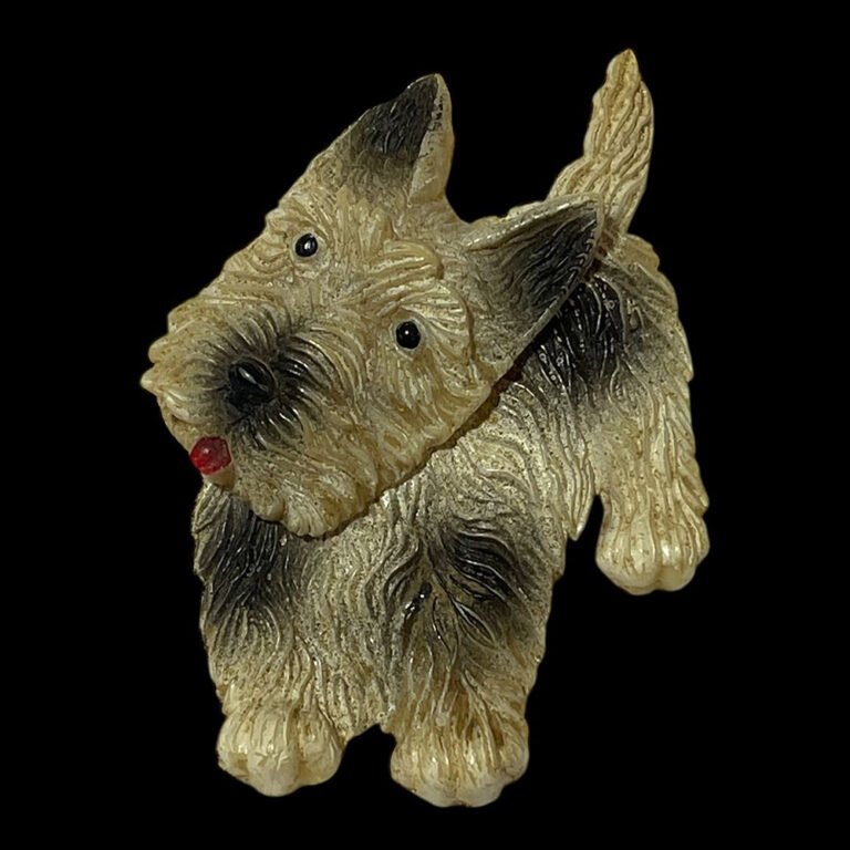 Vintage 1930s celluloid brooch in the form of a jaunty little terrier