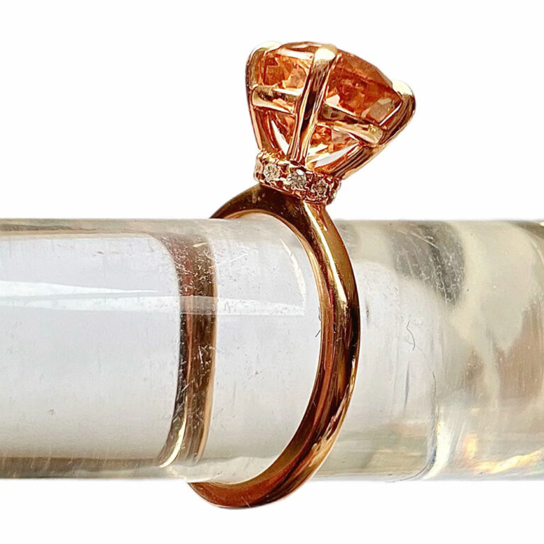 Pink tourmaline and diamond ring with an unusual design to the shank