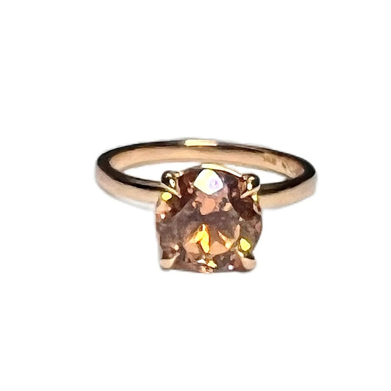Pink tourmaline and diamond ring with an unusual design to the shank