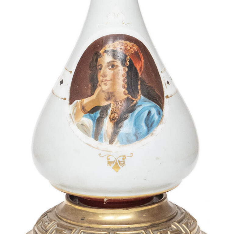 English lamp with Hinks base depicting a figure.