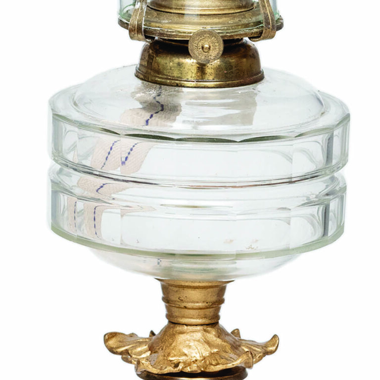 English lamp with ornate brass base, blue column and clear glass font