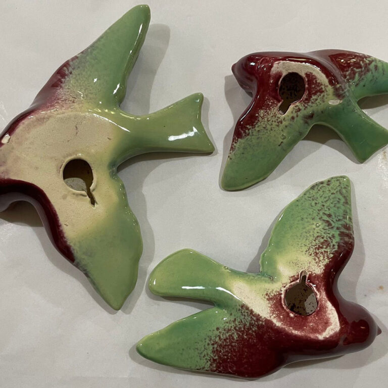 Set of three Australian pottery flying wall swallows