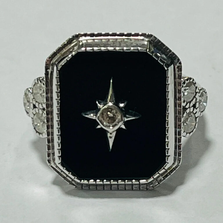 14ct white gold, black onyx and diamond ring