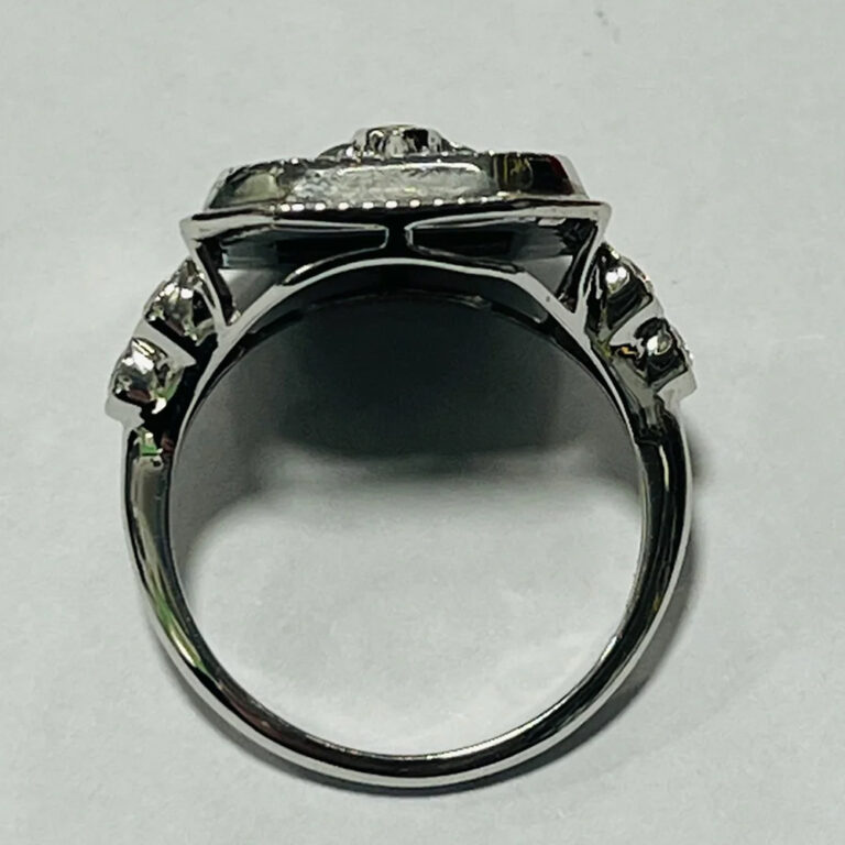14ct white gold, black onyx and diamond ring