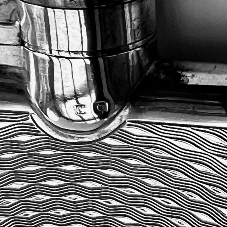 sterling silver hipflask with a finely engine-turned spiralling design