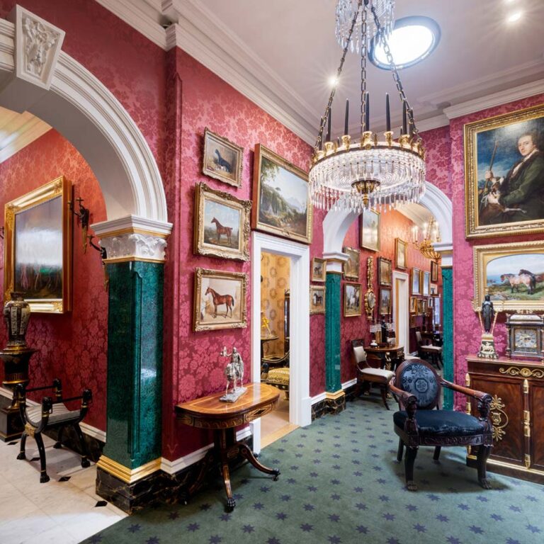 David Roche's Fermoy House: The walls are covered with raspberry-coloured, French silk damask wallpaper.