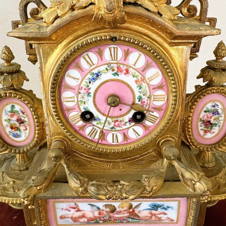 A French Ormolu Clock with Porcelain Enamel Painted Plaques, on Timber Gilt Velvet Stand