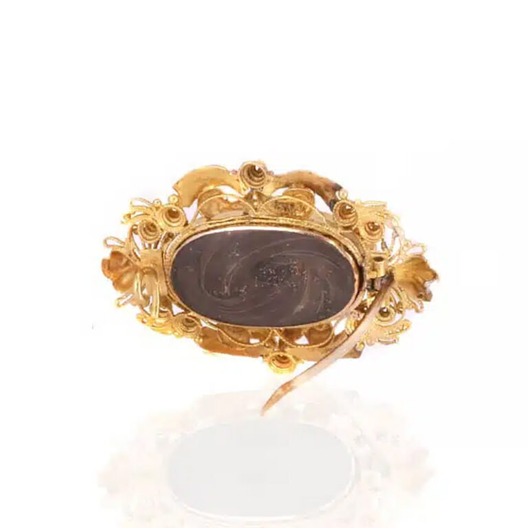 Antique Regard brooch with a locket on the reverse