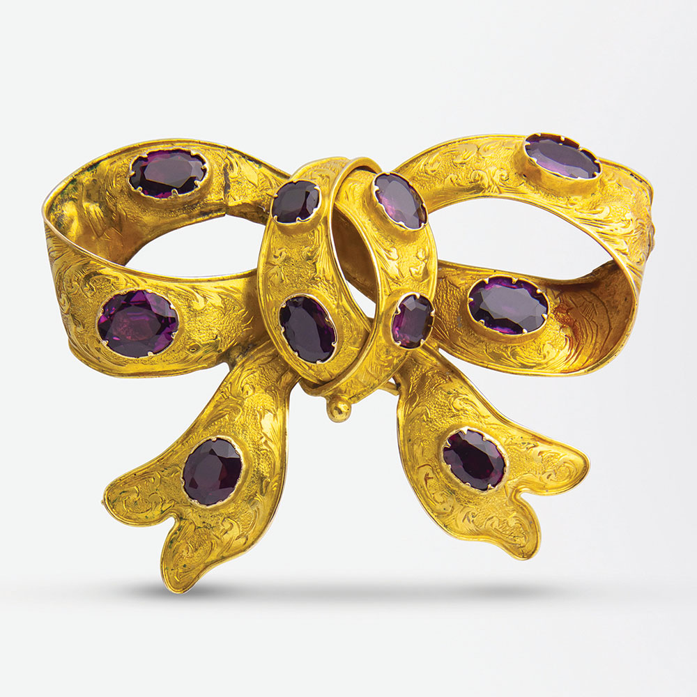 Australian gold and garnet bow brooch