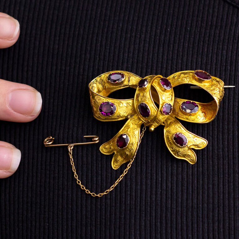 Australian gold and garnet bow brooch