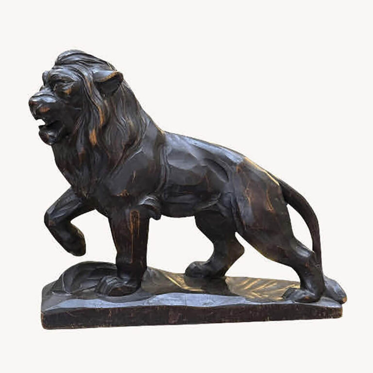 Ebonised carved lion figure