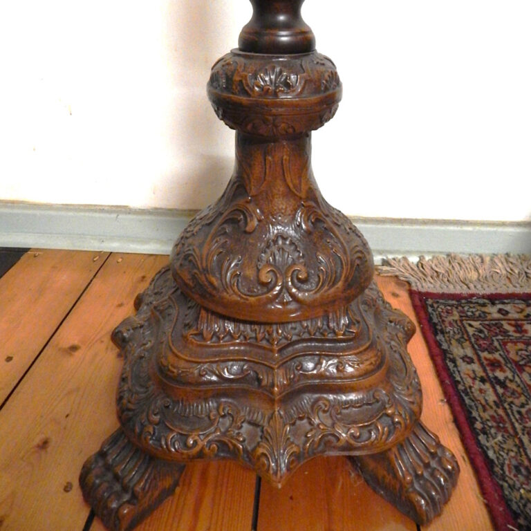 Ornately carved and heavy hat stand