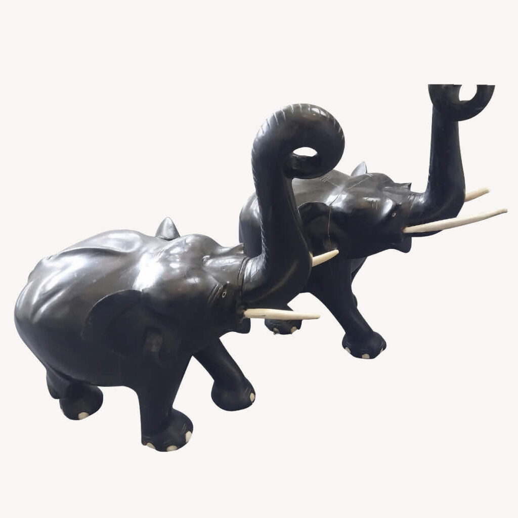 A pair of ebony and ivory elephants c1890s