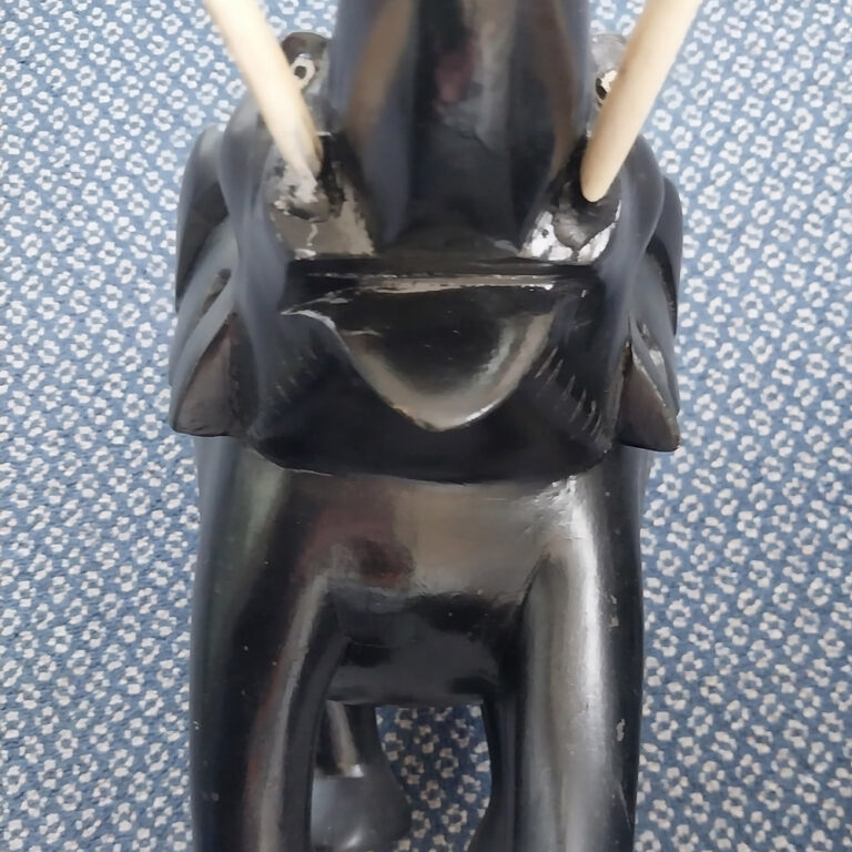 A pair of ebony and ivory elephants c1890s