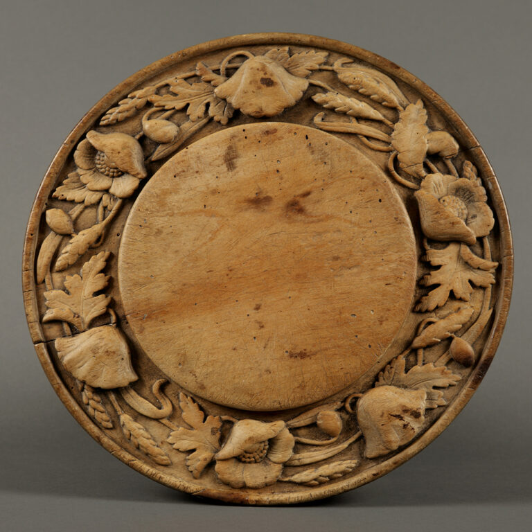 poppy and wheat carved sycamore breadboard