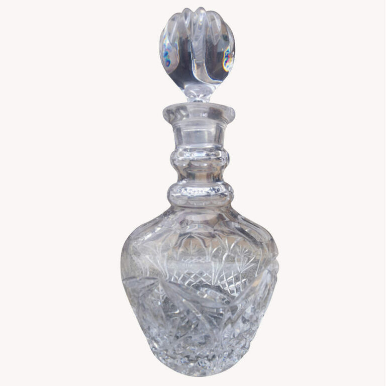 faceted heavy crystal carafe with stopper.