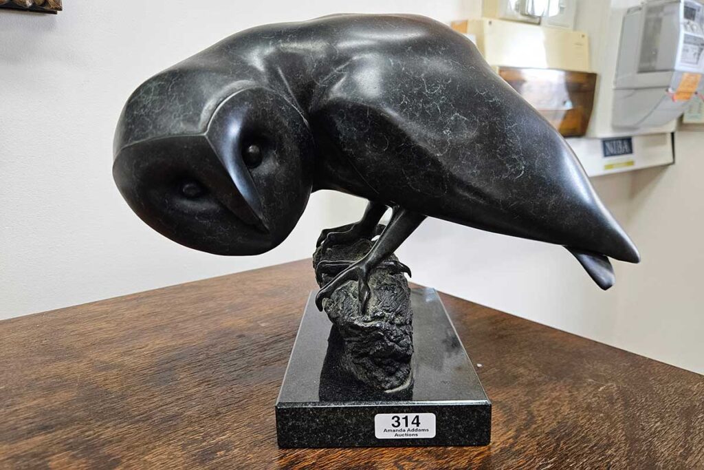 Lucy McEachern (20th century Australian) "Barn Owl" bronze sculpture on marble base, signed Lucy and No 22/25, 25 x 35 x 20 cm. $800 to $1500 at Amanda Addams August Auction