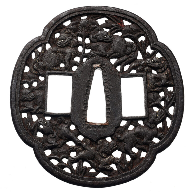 antique samurai sword Japanese tsuba with motif of shishi lion dogs