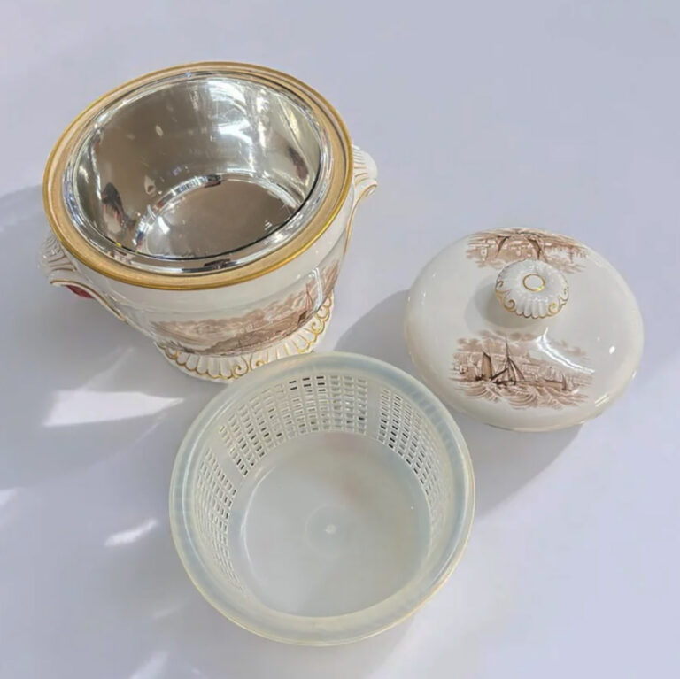 Spode porcelain ice pail with a plastic ice basket and insulated inner