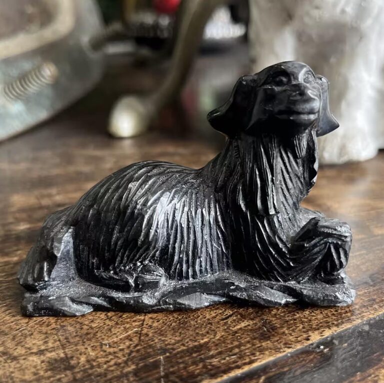 Carved black stone dog figurine