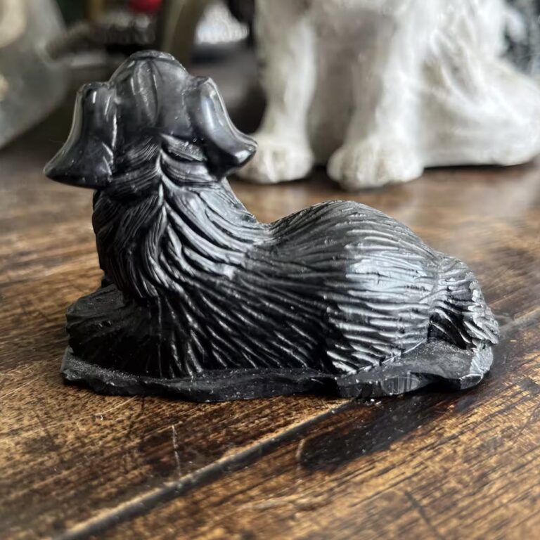 Carved black stone dog figurine