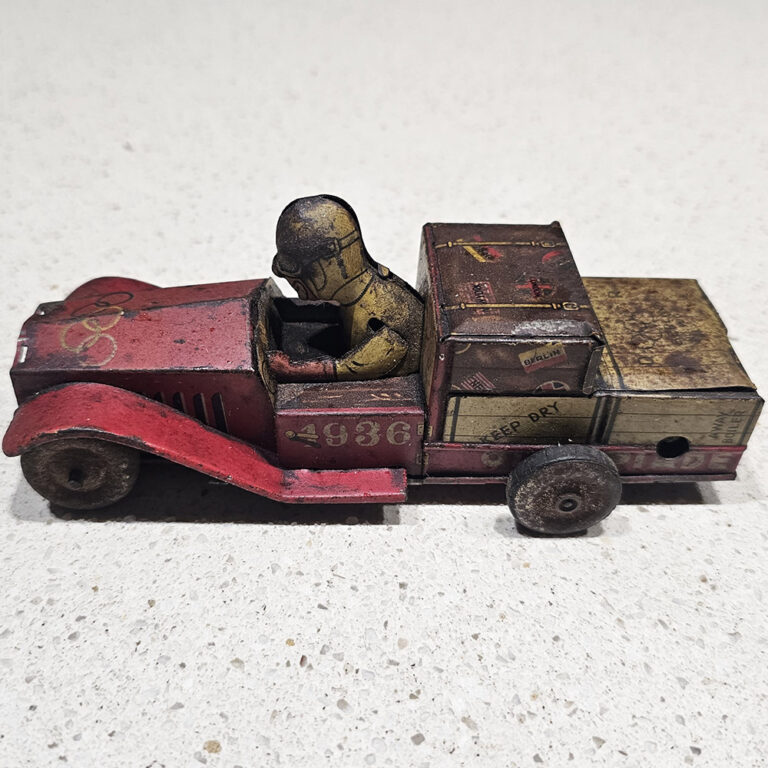 Vintage tin clockwork toy racing car