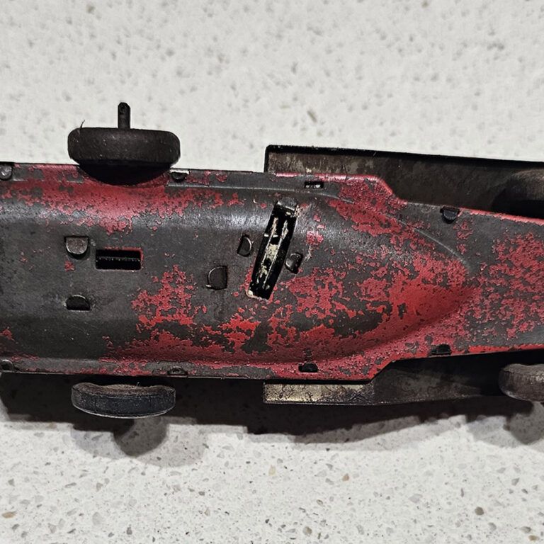 Vintage tin clockwork toy racing car