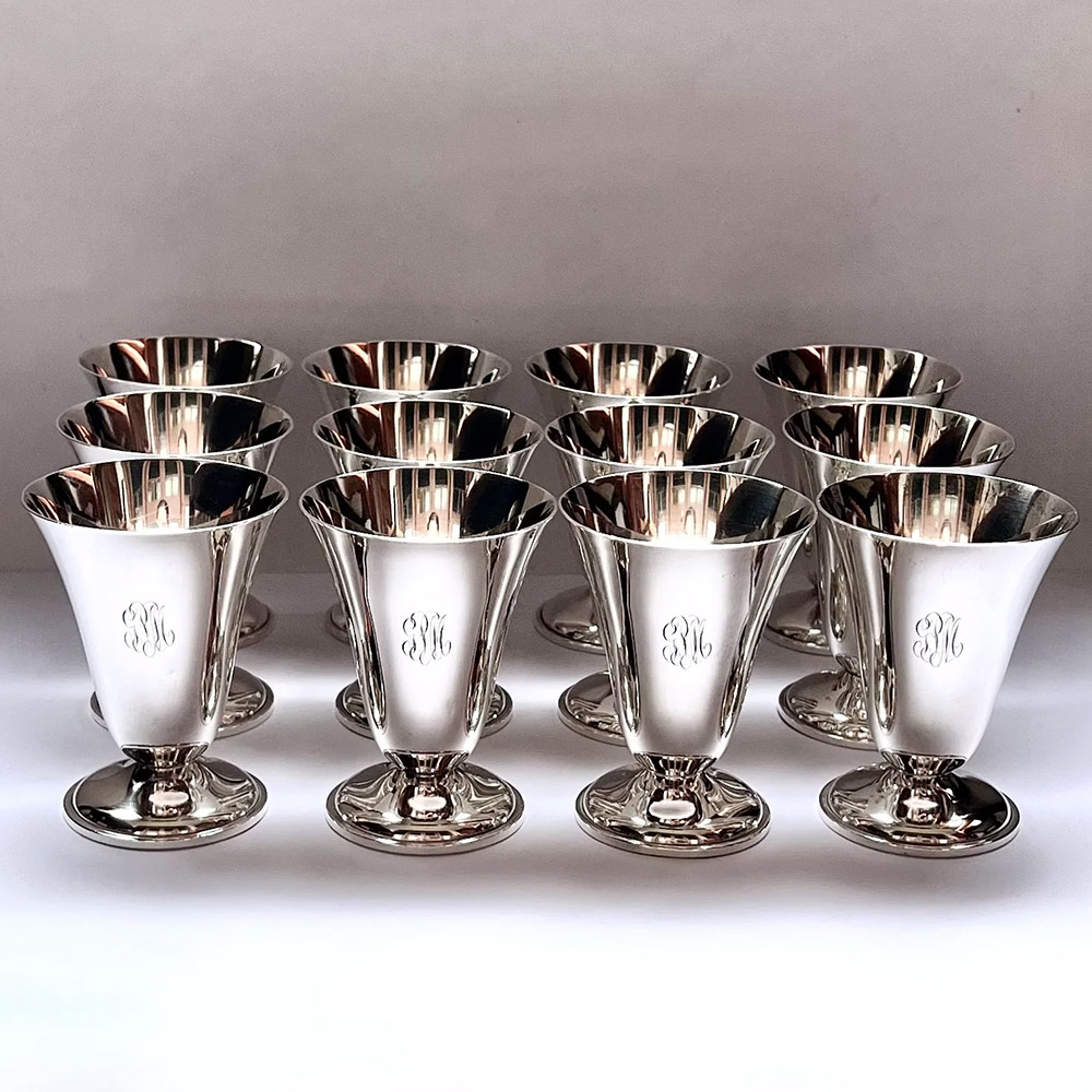 Set of 12 antique American sterling silver cups, with the early stylised hammer mark and initials of Julius Olaf Randahl