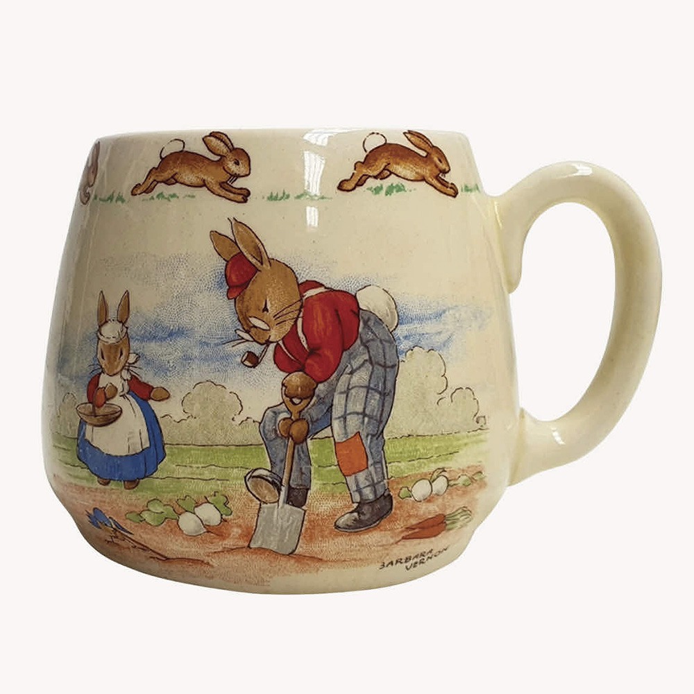 A Royal Doulton Bunnykins mug designed by Barbara Vernon, Gardening /Cycling. Don shape c.1937-53.