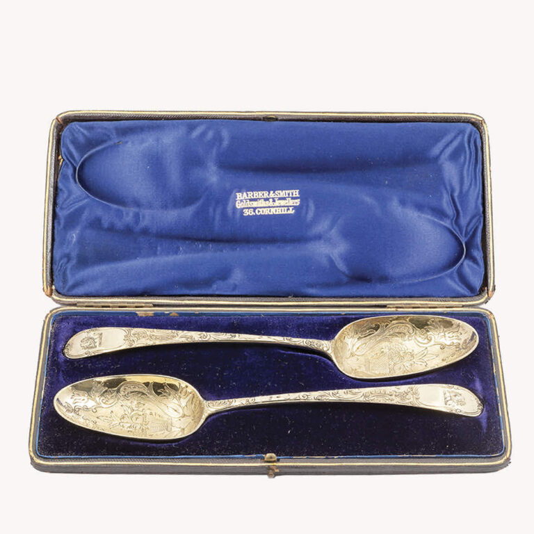 A cased pair of George III antique gilt sterling silver berry spoons, London 1782, William Cattel.