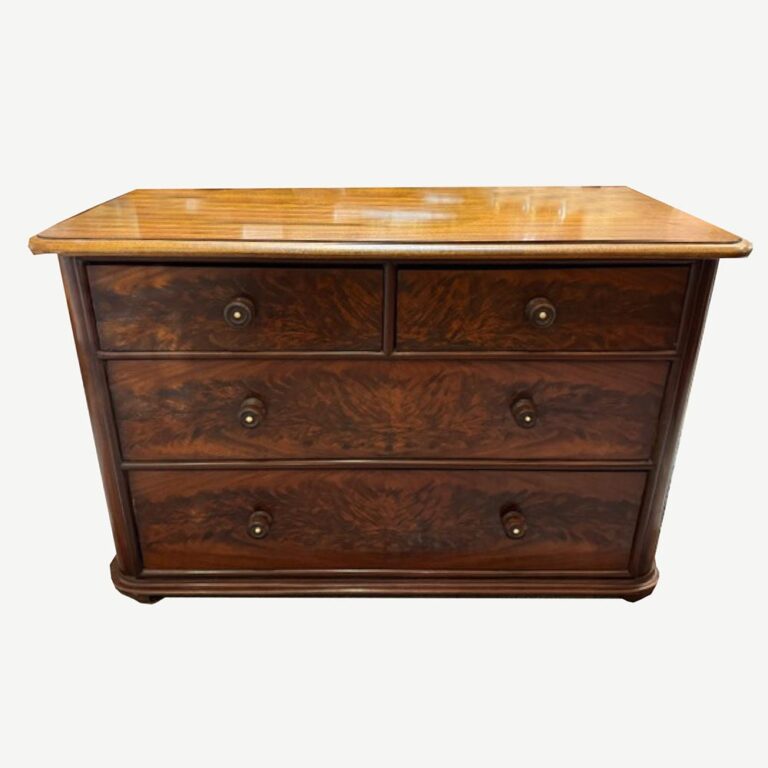 A stunning flame mahogany Victorian chest of four drawers c.1870s, with turned handles and rounded corners.