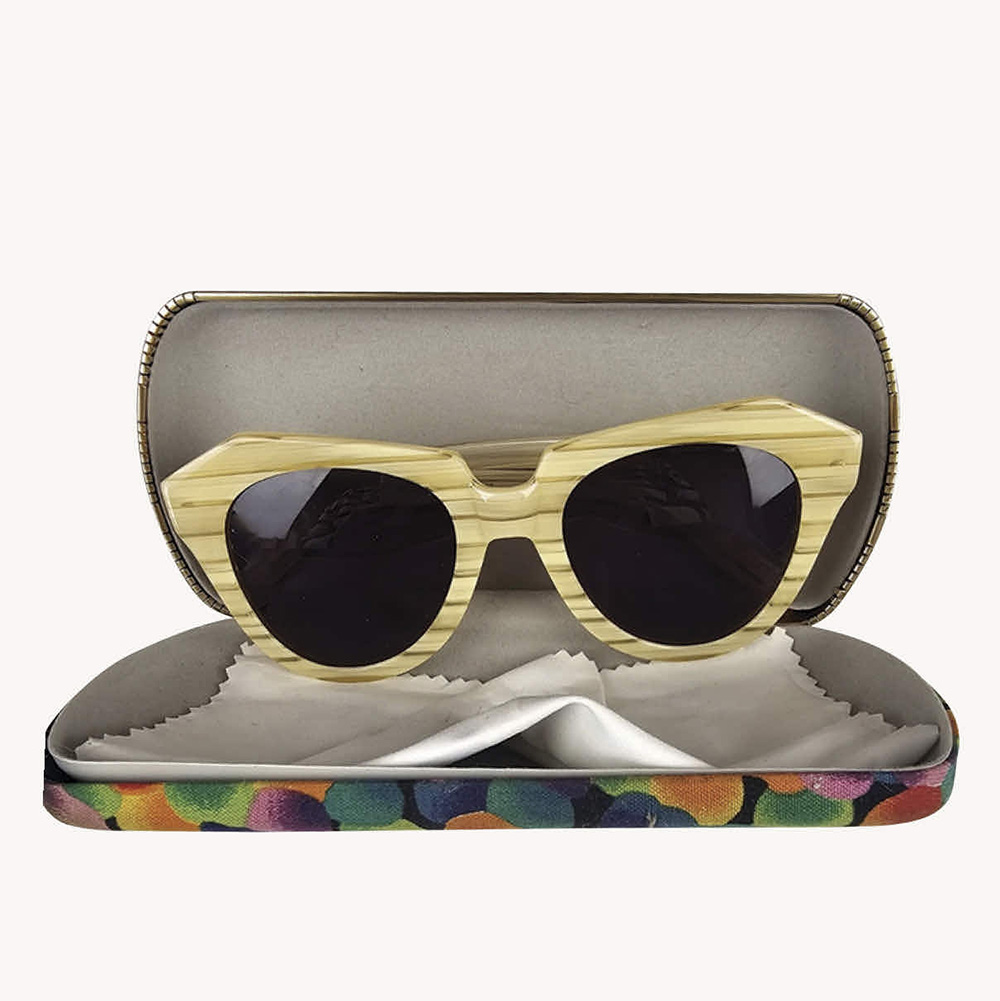 Pair of vintage Karen Walker sunglasses with a cream frame, designed in New Zealand.