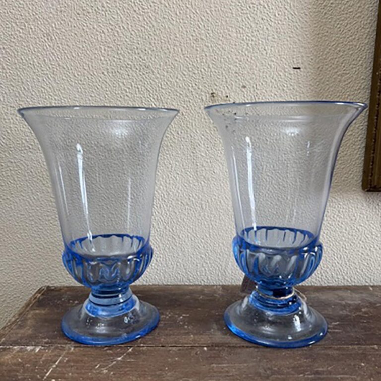 A pair of 19th century hand blown blue crystal urns.