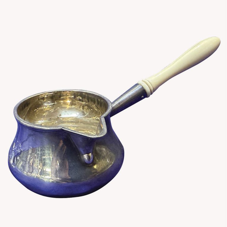 By F.B. Thomas & Co, London 1887, a sterling silver and ivory handled brandy saucepan.