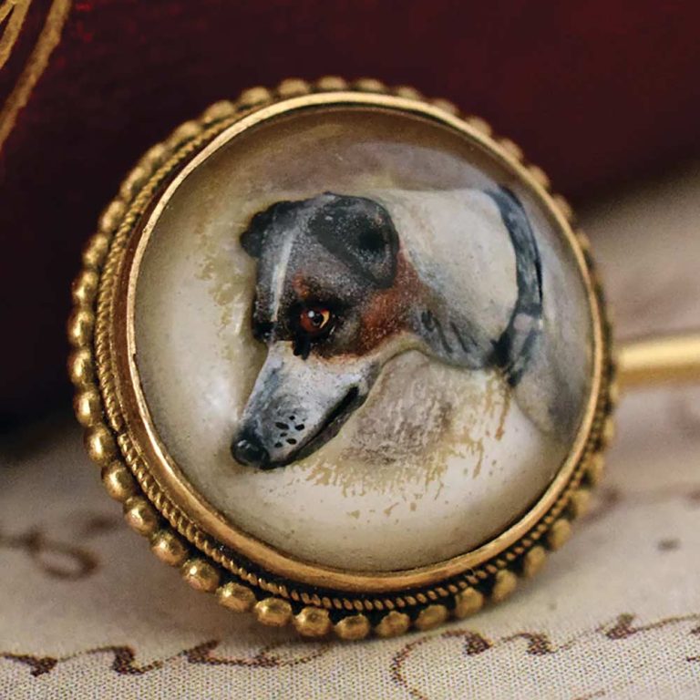 This Victorian stickpin c.1875 shows the crystal cabochon dome and hand painted reverse intaglio of a terrier or Italian greyhound, which would have been painted with a single hair brush; the crystal intaglio is a mere 1.5cm diam. It was offered for sale by Graisons Fine Jewellery (online jewellery store) for $1400. Image: Graisons Fine Jewellery.