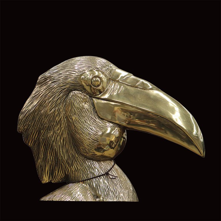 Large brass bird head sculpture