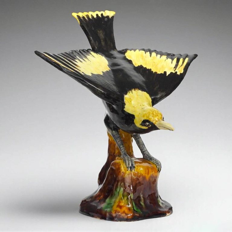 A superb Grace Seccombe earthenware figurine of a regent bowerbird with underglaze painting.