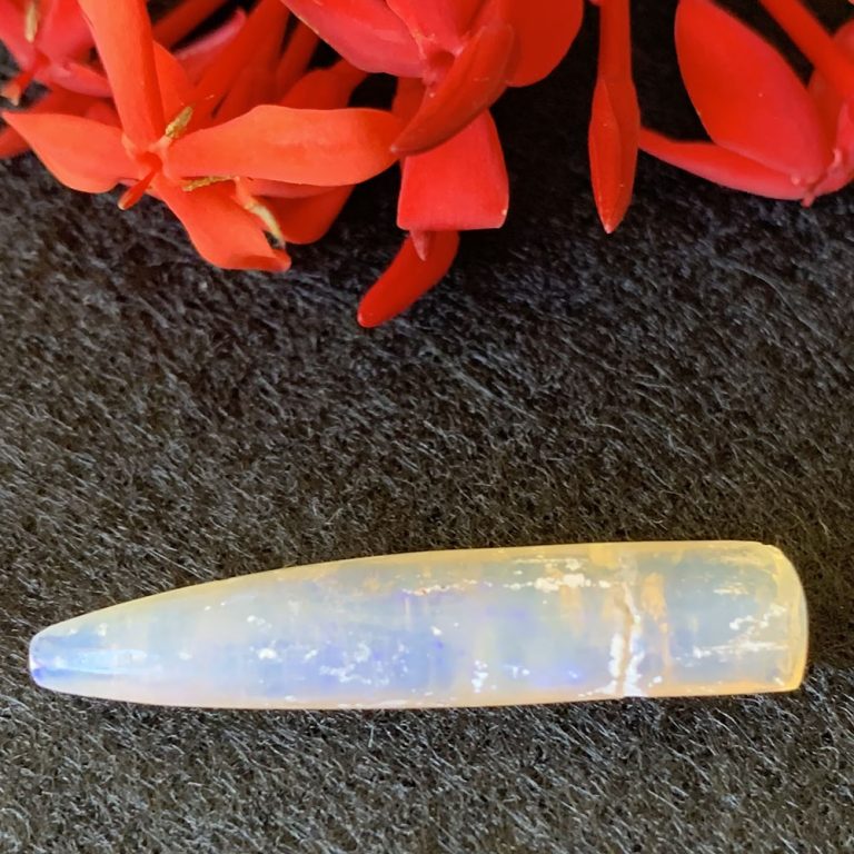 crystal opal belemnite point with a slight play of colour