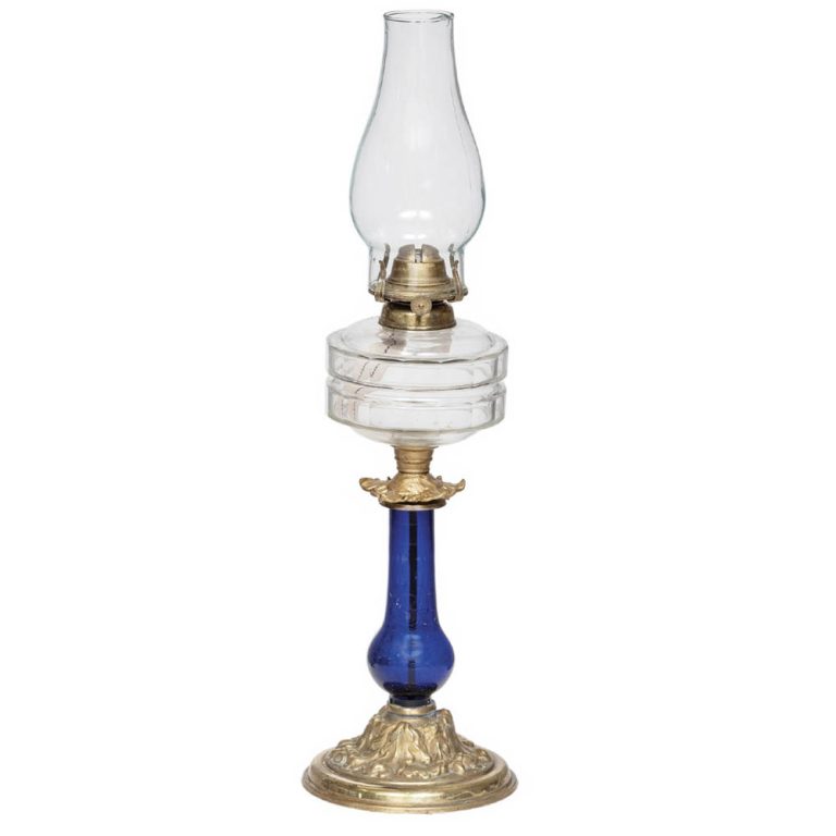 English lamp with ornate brass base, blue column and clear glass font