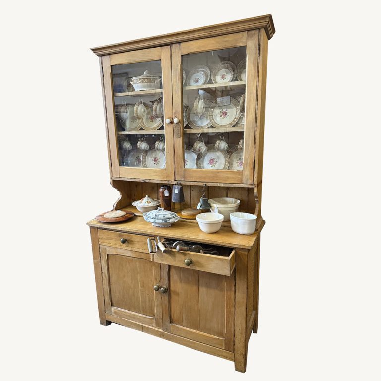 1920s Kauri pine kitchen dresser with glazed door top section enclosing shelves.